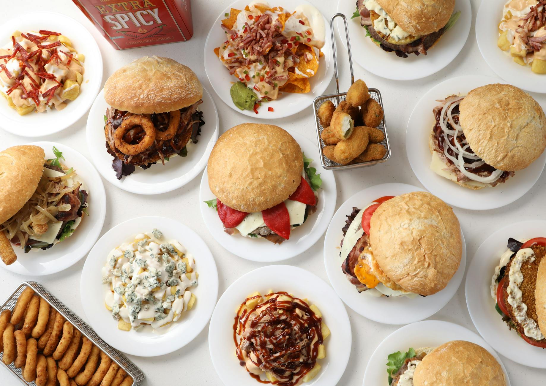 variety of gourmet burgers and sides on display