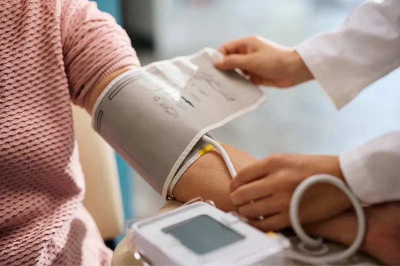 Patient having their blood pressure checked at FourC Health